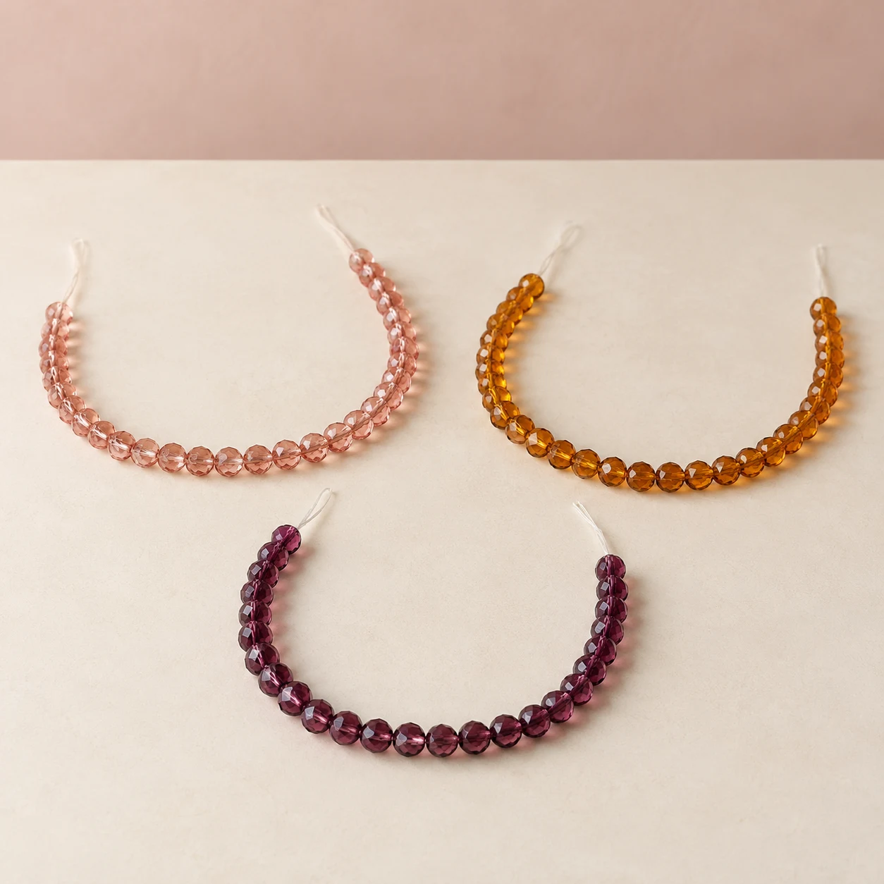 Faceted glass bead strands